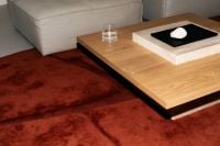 Kaboompics - Minimal Coffee Table On Red Carpet Modern Interior