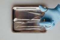 Kaboompics - Dental Needle Holder Above Stainless Steel Instrument Tray