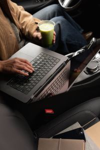 Kaboompics - Laptop, Matcha and Notebooks in a Mobile Office Car