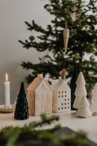 Kaboompics - Christmas Village and Tree Figurines with Candlelight