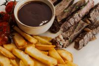 Kaboompics - Steak Slices with Fries and Dipping Sauce