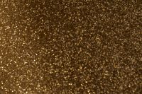 Kaboompics - Dark Gold Glitter Surface With Dramatic Contrast