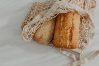 Kaboompics - Ciabatta and Baguette Loaves Inside a Reusable Mesh Shopping Bag
