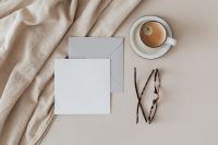 Kaboompics - Blank Business Card and Envelope with Coffee and Tortoiseshell Glasses on Linen