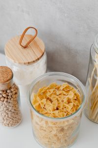 Kaboompics - Wooden-Lidded Flour Jar beside Chickpeas and Cookie Props, Kitchen Close-Up