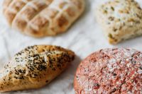 Kaboompics - Beetroot Bread and Assorted Slovenian Buns, Rustic Bakery Close-Up for Food Editorial