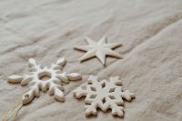 Kaboompics - Soft Neutral Holiday Background with White Star and Snowflake Ornaments