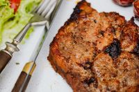Kaboompics - Grilled Pork Neck and Sliced Sausage beside Lettuce and Tomato on a White Plate
