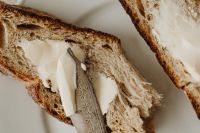 Kaboompics - Butter Knife on Fresh Bread Close-Up