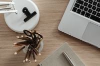 Kaboompics - Overhead Home Office Flat Lay with Laptop, White Desk Lamp, Pencils and Open Notebook