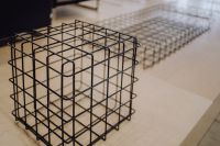 Kaboompics - Black Metal Wire Side Table Frame, Minimalist Furniture Detail in Soft Focus