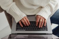 Kaboompics - Top View of Hands Typing on a Laptop