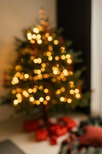 Kaboompics - Blurred Christmas Tree with Golden Bokeh Lights and Red Wrapped Gifts