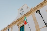 Kaboompics - Clock Tower and Flags Above Calasetta Town Hall