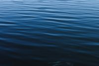 Dark Blue Water Ripples with a Deep Shadow Gradient, Moody Abstract Wallpaper for Web Design