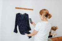 Kaboompics - Navy Polka Dot Dress on a Hanger for an Online Boutique Product Listing
