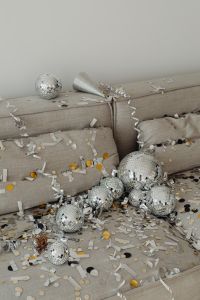 Kaboompics - New Year's Eve Sofa Party with Disco Balls and Festive Party Hat