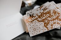 Kaboompics - Festive Christmas Card on White Envelope and Dark Fabric
