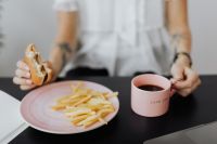 Kaboompics - Businesswoman Enjoying Burger at Her Office Desk