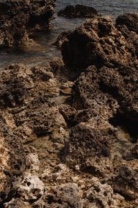 Kaboompics - Small Waves Washing Between Coastal Boulders
