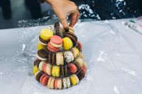 Kaboompics - Hand taking a macaron