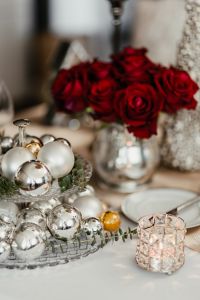 Kaboompics - Red Roses in a Silver Vase with Christmas Table Decorations