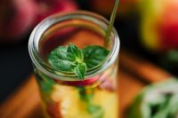 Kaboompics - Two Peach Citrus Drinks Beneath White Hydrangeas, Elegant Summer Menu and Social Media Photo