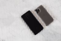 Kaboompics - Angled Pair of Black and Silver Smartphones Seen from Behind on Marble