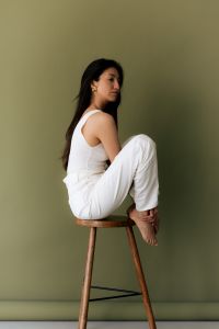 Kaboompics - Woman in White Outfit Sitting on Stool