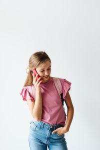 Kaboompics - Student Using Phone with School Backpack