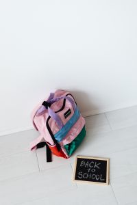 Kaboompics - Girl Packing School Backpack with Books