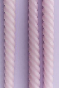 Kaboompics - Pink Twisted Candles Minimal Background