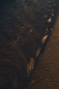 Kaboompics - Dark Beach Background Golden Hour Sea Texture