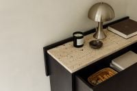 Kaboompics - Black Console with Travertine Top, Lamp and Open Drawer