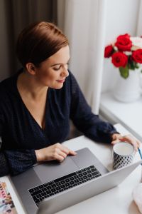 Kaboompics - Happy casual beautiful woman working on a laptop