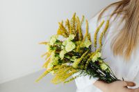 Kaboompics - Woman with Goldenrod and Carnations for Floral Editorials