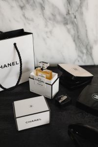 Kaboompics - Chanel No. 5 Perfume and Beauty Products on Black Surface