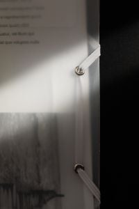 Kaboompics - Translucent Document Folder with Elastic Closure on Black Background