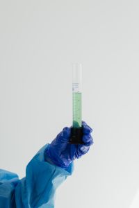 Kaboompics - Graduated Cylinder With Green Liquid and Copy Space