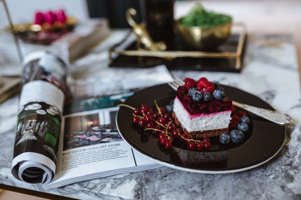 Kraft Raspberry Commercial Vertical Raspberry on Fork with Soft-Focus Cheesecake Background ...
