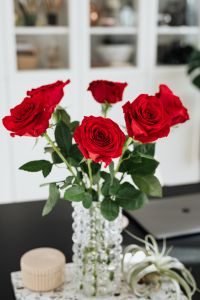 Kaboompics - Bright Home Office Workspace with Red Roses and Laptop