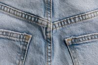 Kaboompics - Back Yoke Seams and Center Stitching between Jeans Pockets, Light Wash Denim