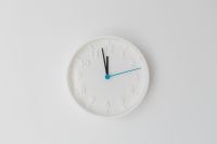 Kaboompics - Minimal White Wall Clock on a Bright Neutral Background