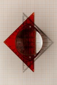 Kaboompics - Optical Glass Sphere with Red Geometric Pattern
