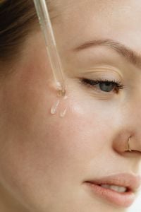 Kaboompics - Close-Up of Facial Serum Applied with a Dropper to the Cheek