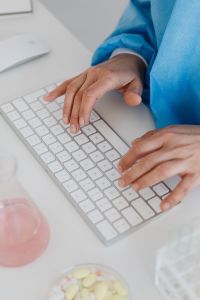 Kaboompics - Researcher Using Computer Keyboard at Laboratory Desk
