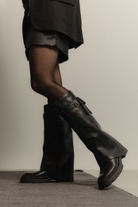 Kaboompics - Woman Wearing Tall Black Boots with Crossed Legs