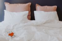 Kaboompics - A diary with red heart on the bed