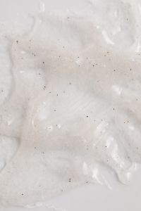 Kaboompics - Speckled White Skincare Cream Smears on a Minimal Macro Background