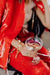 Kaboompics - Overhead Champagne Toast over Red Sequin Pants